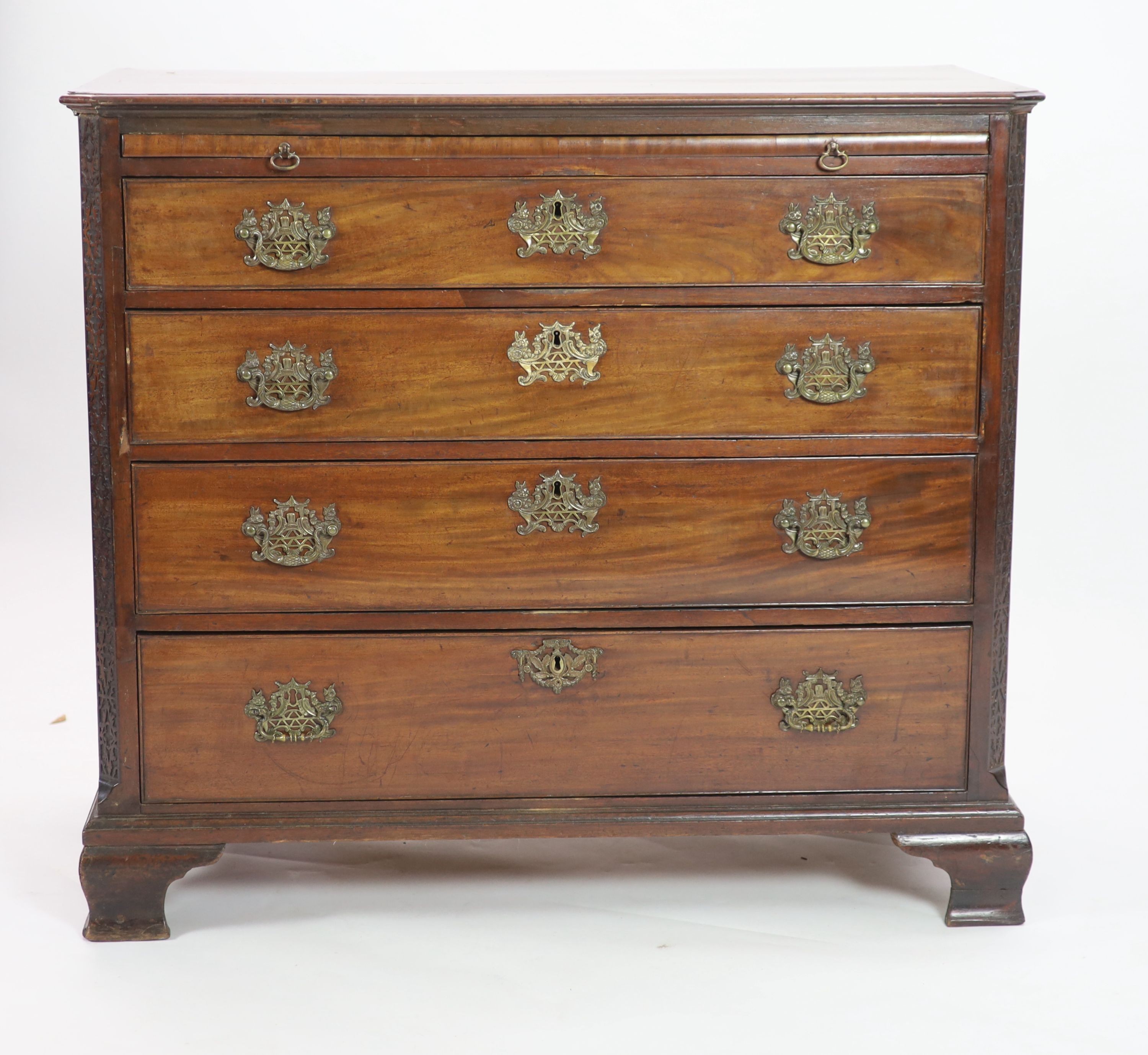 A George III mahogany four drawer chest of drawers with brushing slide, width 110cm, depth 54cm, height 98cm